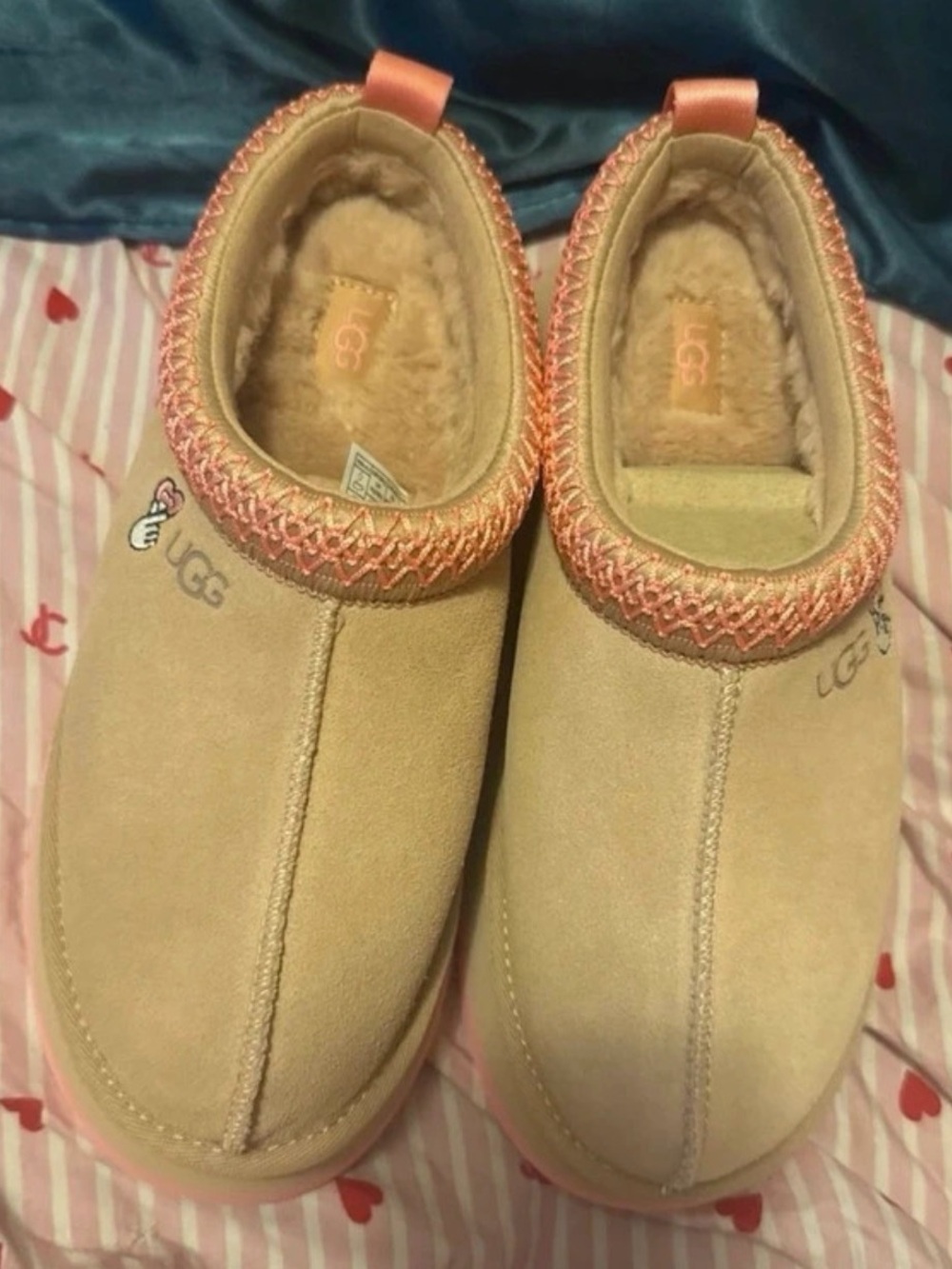 UGG Kids Slip-On Shearling Lined Slippers in Light Pink and Cream